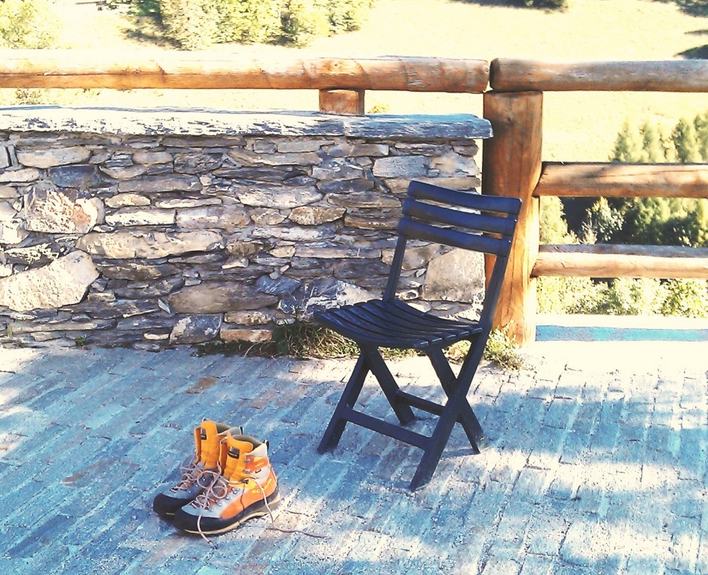 Hiking in Piemonte - hiking shoes on floor in front of seat