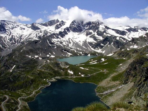 Gran Paradiso National Park snowcapped mountains with alpine lake in the valley