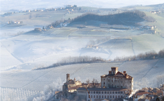 Barolo castle with rolling hills in the midst