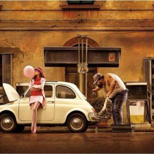 Vintage Fiat 500 with lady putting gas in car at vintage gas station