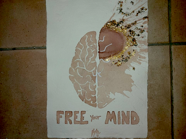 Wine Art in Barolo includes art classes and this wine painting of a brain which reads Free Your Mind